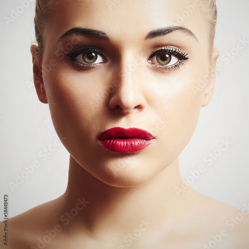 Photo: beautiful woman with red lips.portrait.make-up beautiful woman with red lips.portrait.make-up