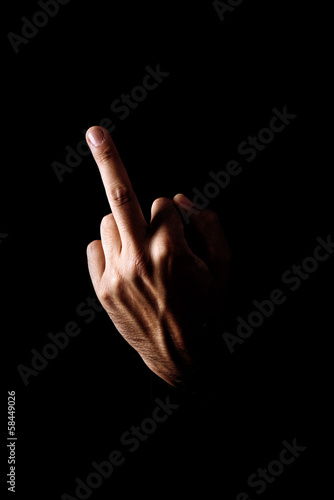 Photo: Middle finger on black background Middle finger on black background