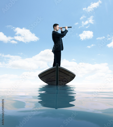 Photo: businessman with telescope businessman with telescope