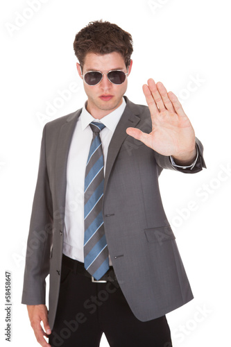 Photo: Young Businessman Showing His Hand Young Businessman Showing His Hand