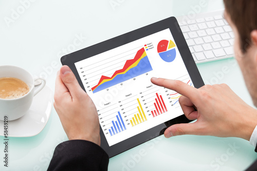 Photo: Businessman Using Digital Tablet Businessman Using Digital Tablet