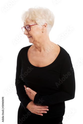 Photo: An old lady is having a stomachache. An old lady is having a stomachache.