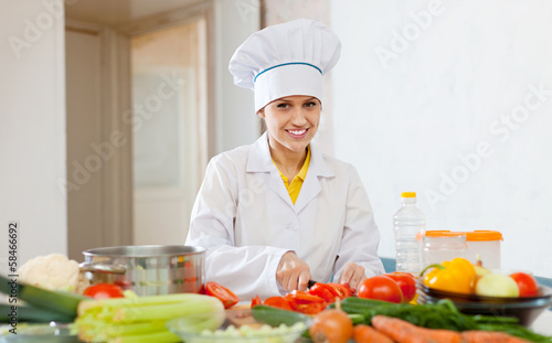 Photo: cook works with vegetables at commercial kitchen cook works with vegetables at commercial kitchen