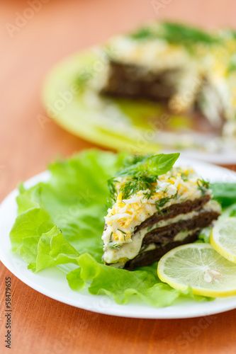 Photo: Liver cake with garlic and dill sauce on a plate Liver cake with garlic and dill sauce on a plate