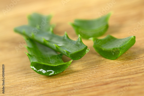 Photo: aloe vera on wooden surface aloe vera on wooden surface