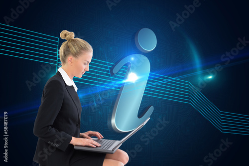 Photo: Composite image of businesswoman using laptop Composite image of businesswoman using laptop