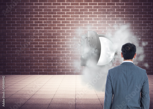 Photo: Composite image of businessman standing Composite image of businessman standing