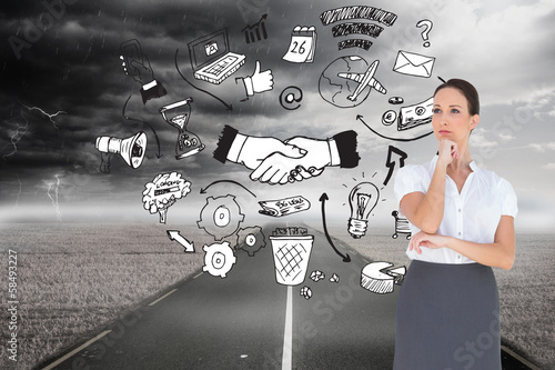 Photo: Composite image of pensive elegant businesswoman posing Composite image of pensive elegant businesswoman posing