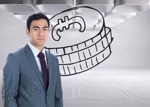 Photo: Composite image of unsmiling businessman standing Composite image of unsmiling businessman standing