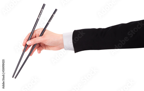 Photo: Businessman's hand Holding Chopsticks Businessman's hand Holding Chopsticks