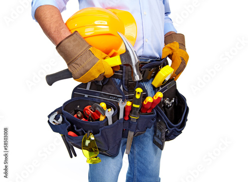 Photo: Worker with a tool belt. Construction. Worker with a tool belt. Construction.