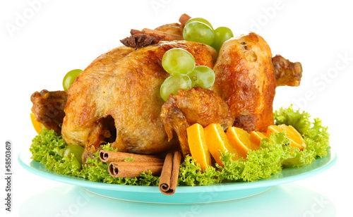 Photo: whole roasted chicken with lettuce, grapes, oranges and spices whole roasted chicken with lettuce, grapes, oranges and spices