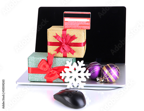 Photo: Laptop, gifts and computer mouse isolated on white Laptop, gifts and computer mouse isolated on white