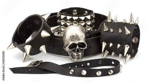 Photo: Rock style leather belt and bracelet isolated on white backgroun Rock style leather belt and bracelet isolated on white backgroun