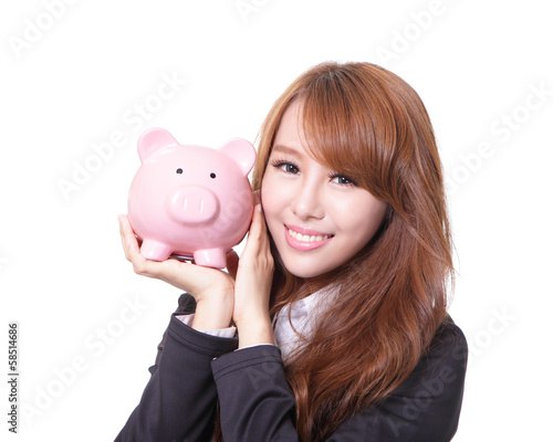 Photo: Piggy bank savings woman smiling happy Piggy bank savings woman smiling happy