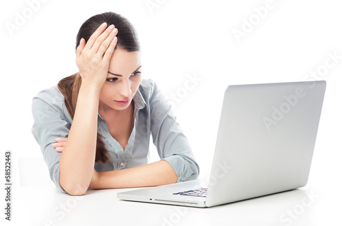 Photo: Worried woman using laptop Worried woman using laptop