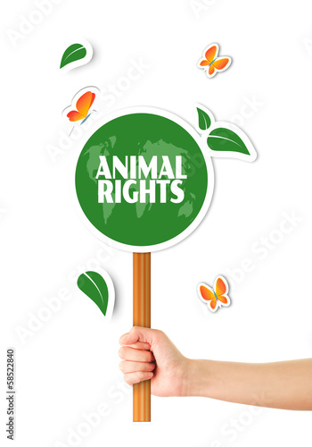 Illustration: Hand holding green animal rights sign Hand holding green animal rights sign