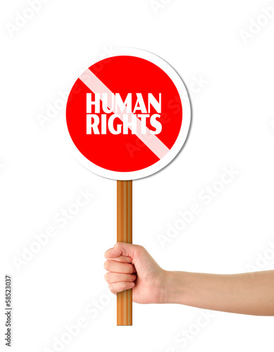 Illustration: Hand holding red human rights sign Hand holding red human rights sign