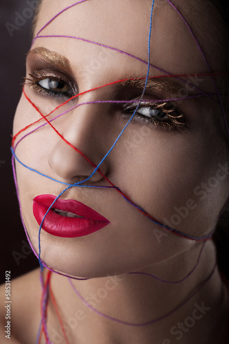 Photo: girl in a web of threads. girl in a web of threads.
