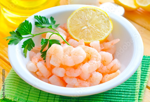 Photo: boiled shrimps in the white bowl on the table boiled shrimps in the white bowl on the table
