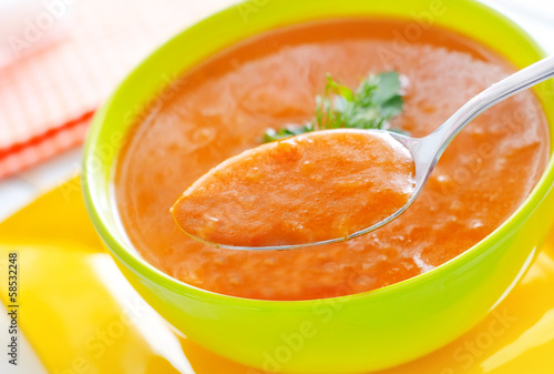 Photo: Fresh soup from pumpkin in the green bowl Fresh soup from pumpkin in the green bowl