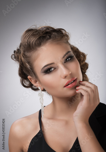 Photo: Portrait of young brunette girl with long hair Portrait of young brunette girl with long hair