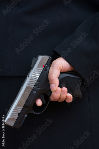 Photo: Woman holding a hand gun Woman holding a hand gun