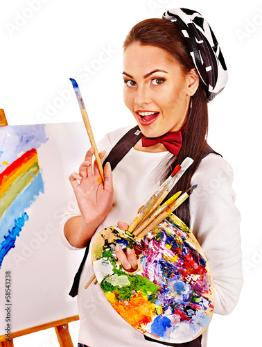 Photo: Female artist at work. Female artist at work.