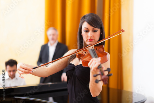 Photo: Woman playing violin Woman playing violin