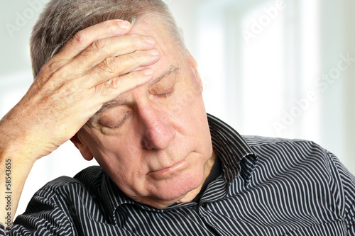 Photo: Senior man with a headache Senior man with a headache