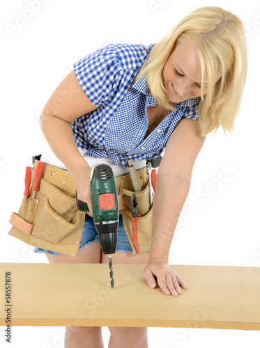 Photo: Weiblicher Handwerker bohrt Weiblicher Handwerker bohrt