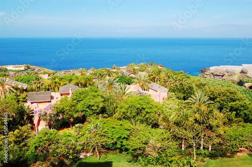 Photo: Recreation area with villas of luxury hotel and banana's plantat Recreation area with villas of luxury hotel and banana's plantat