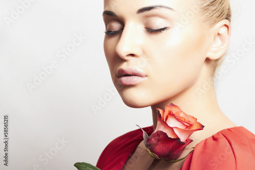 Photo: Girl and flower. beautiful woman in red dress.close-up. rose Girl and flower. beautiful woman in red dress.close-up. rose