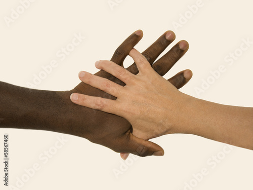 Photo: Mixity - Two joint hands symbolizing diversity Mixity - Two joint hands symbolizing diversity