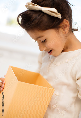 Photo: happy child with gift box happy child with gift box