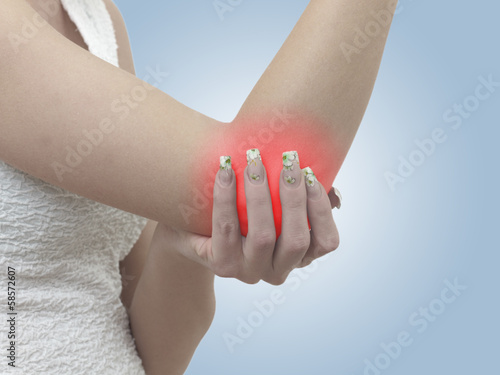Photo: Pain in a woman elbow Pain in a woman elbow