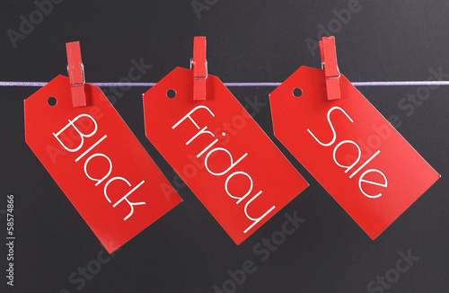 Photo: Black Friday shopping sale concept red tickets Black Friday shopping sale concept red tickets