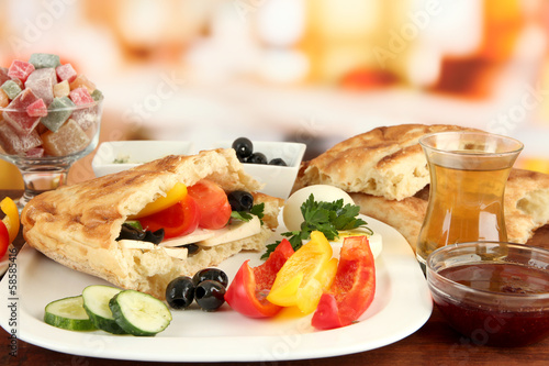 Photo: Traditional Turkish breakfast on table on bright background Traditional Turkish breakfast on table on bright background