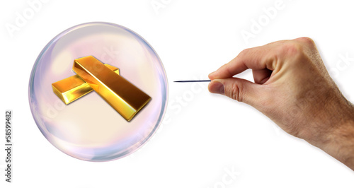Photo: Gold value Bubble about to explode by a needle Gold value Bubble about to explode by a needle
