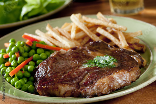 Photo: juicy ribeye steak with vegetables juicy ribeye steak with vegetables