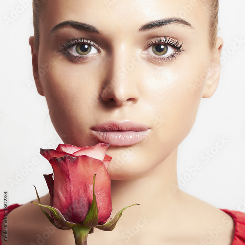 Photo: beautiful blond woman with flower.girl and rose.tender beautiful blond woman with flower.girl and rose.tender