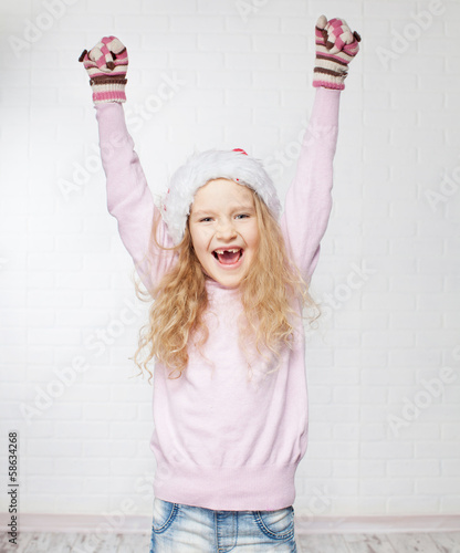 Photo: Child in christmas hat Child in christmas hat