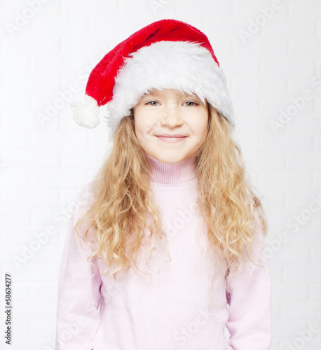 Photo: Child in christmas hat Child in christmas hat
