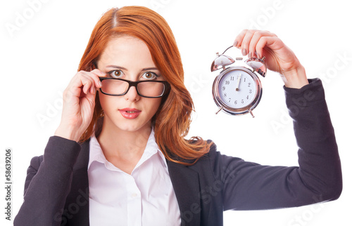 Photo: Redhead girl with clock Redhead girl with clock
