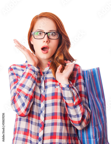 Photo: Redhead girl with shopping bag Redhead girl with shopping bag