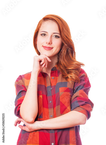 Photo: Redhead girl in shirt on white background isolated. Redhead girl in shirt on white background isolated.