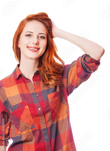 Photo: Redhead girl in shirt on white background isolated. Redhead girl in shirt on white background isolated.