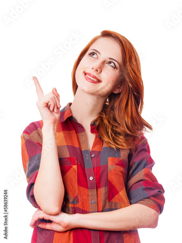 Photo: Redhead girl in shirt on white background isolated. Redhead girl in shirt on white background isolated.