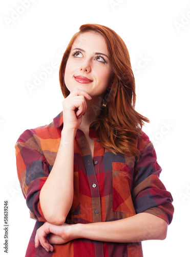 Photo: Redhead girl in shirt on white background isolated. Redhead girl in shirt on white background isolated.