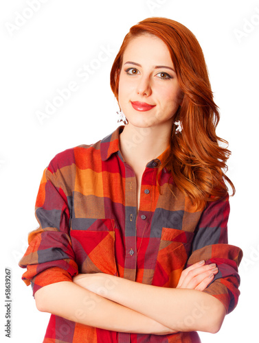 Photo: Redhead girl in shirt on white background isolated. Redhead girl in shirt on white background isolated.